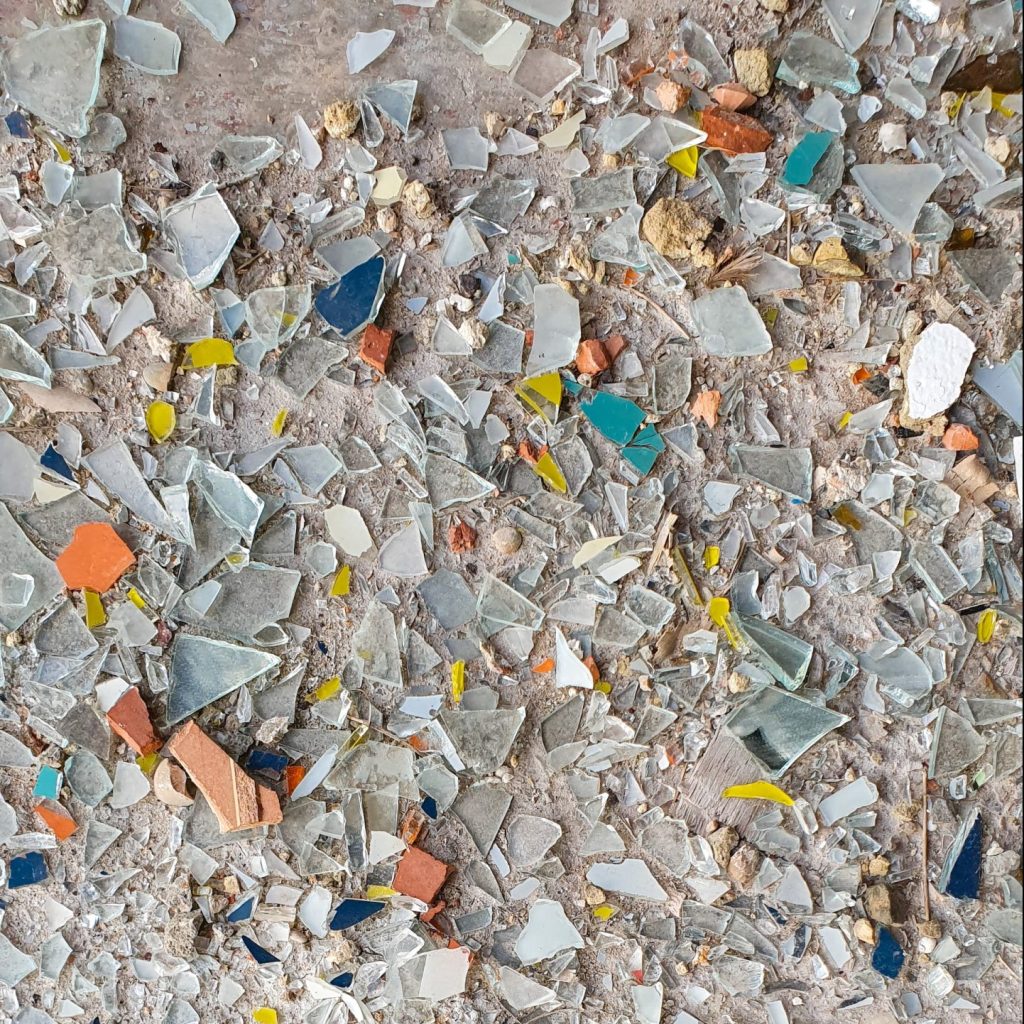 broken shells and glass on a seashore