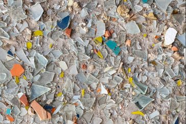 broken shells and glass on a seashore